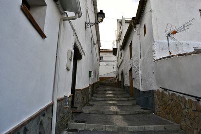 Narrow alley along buildings