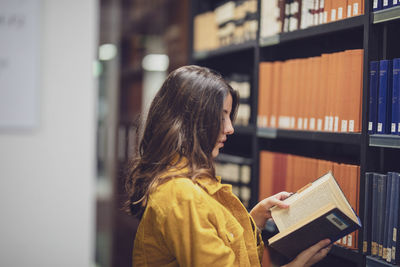 Woman looking at book