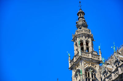 Low angle view of building against blue sky