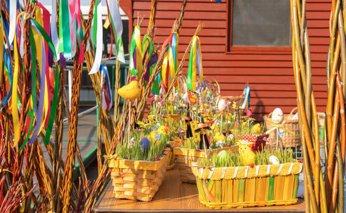 Multi colored flowers in basket of building