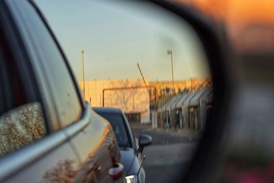 Close-up of side-view mirror of car