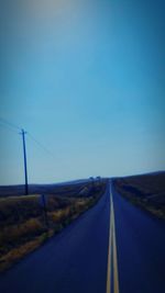 Empty road along landscape