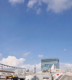 Low angle view of buildings against blue sky