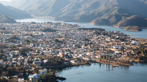 High angle view of river by town against sky