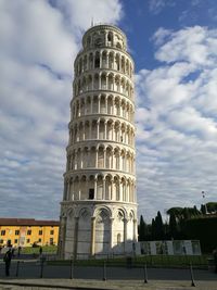 Low angle view of historical building against cloudy sky