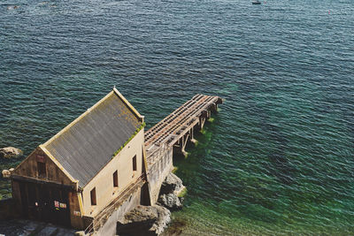 High angle view of building by sea at lizard point in cornwall, england