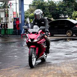 Man riding motorcycle on street