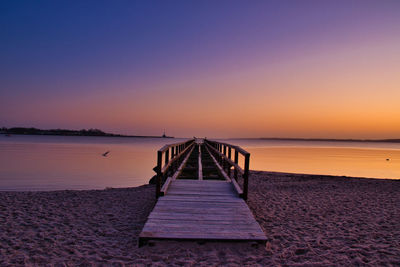 Scenic view of sea against clear sky during sunset