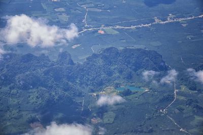 High angle view of airplane flying over land