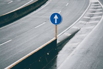 High angle view of road sign on street