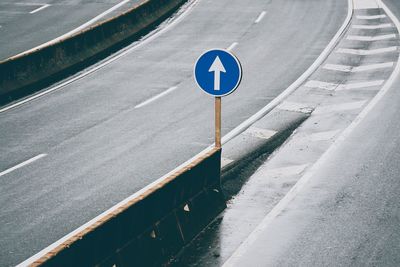 High angle view of road sign on street