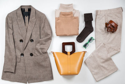 High angle view of personal accessories on white background