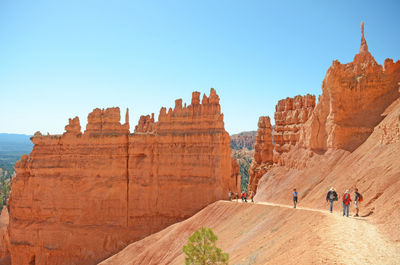 Scenic view of mountains against blue sky