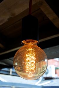 Low angle view of illuminated light bulb