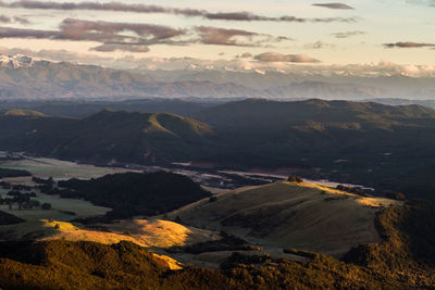 Aerial view of valley and mountains against sky