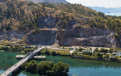 View of bridge over lake with mountain in background