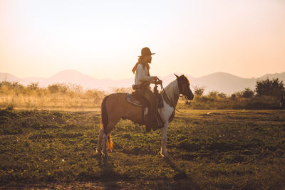 Man riding horse in a field