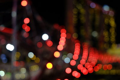 Defocused image of illuminated lights at night