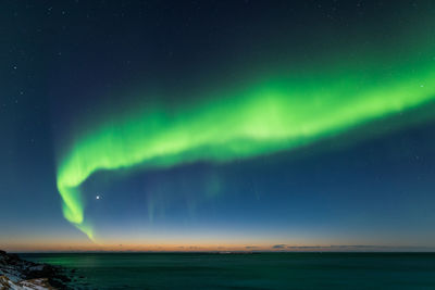 Scenic view of sea against sky at night