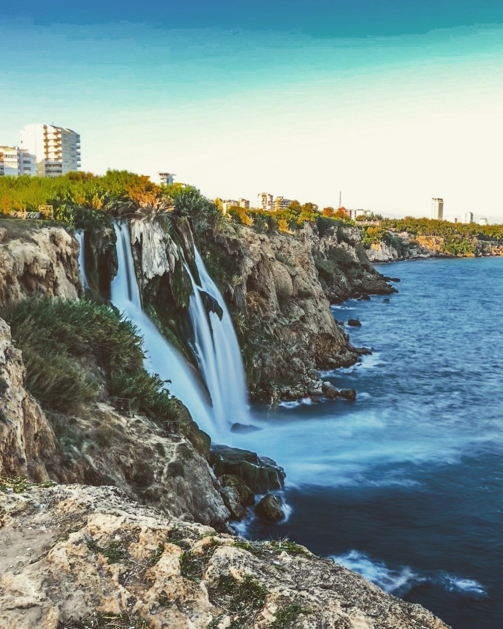 SCENIC VIEW OF ROCKS IN CITY AGAINST SKY