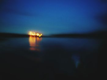 Scenic view of sea against sky at night