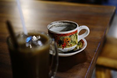 Close-up of coffee cup on table