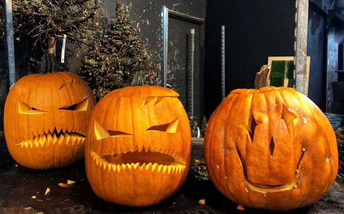Various pumpkins on illuminated pumpkin during halloween