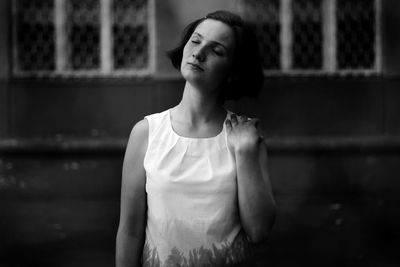 Portrait of a young woman looking away