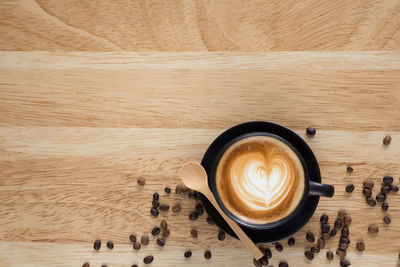 Directly above shot of cappuccino on wooden table