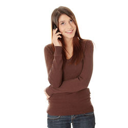 Portrait of smiling young woman against white background