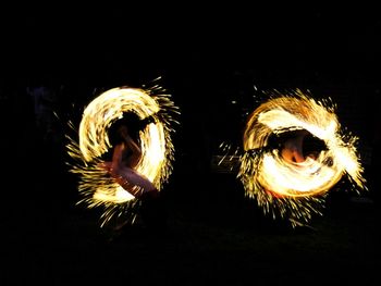 Close-up of fire burning over black background