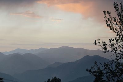 Scenic view of silhouette mountains against sky at sunset