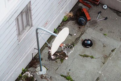 High angle view of broken glass on footpath in city