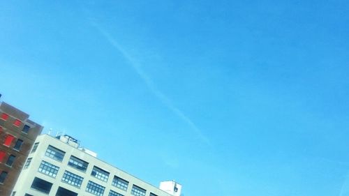 Low angle view of built structure against clear blue sky