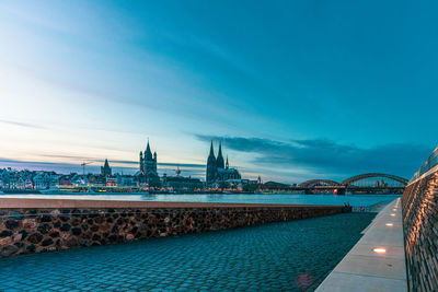 Rhine promenade in cologne with a view of cologne cathedral at the blue hour, germany.