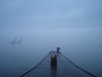 Pier over sea against sky