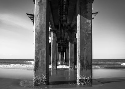 View of pier over sea against sky