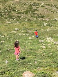 High angle view of girl and woman on field