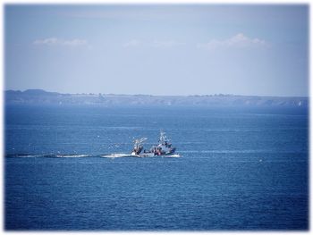 Boat sailing in sea