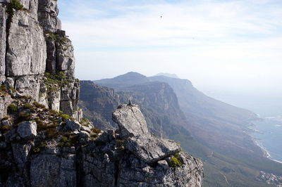 Scenic view of cliff against sky