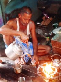 Midsection of man preparing food