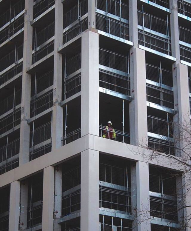 LOW ANGLE VIEW OF MEN WORKING