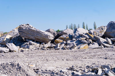 Stack of rocks against blue sky