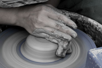 Cropped image of potter working at workshop