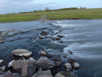 Scenic view of river against sky