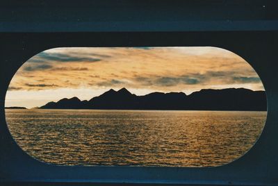 Scenic view of dramatic sky over landscape during sunset