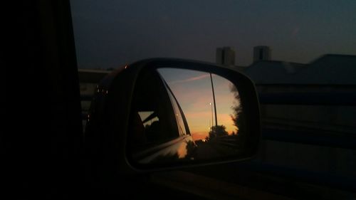 Reflection of car on road at dusk