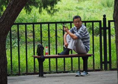 Portrait of a man sitting in park