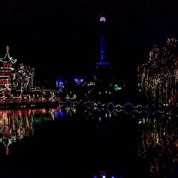 Illuminated city buildings at night