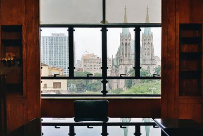 Buildings seen through glass window